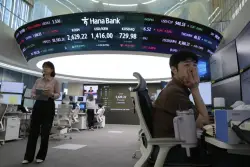 Asian shares mostly gain amid cautious relief over U.S.-China agreement