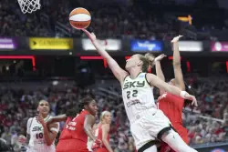 Clark has triple-double to lead Fever past Sky 93-58 as tempers flare after hard foul in 3rd quarter